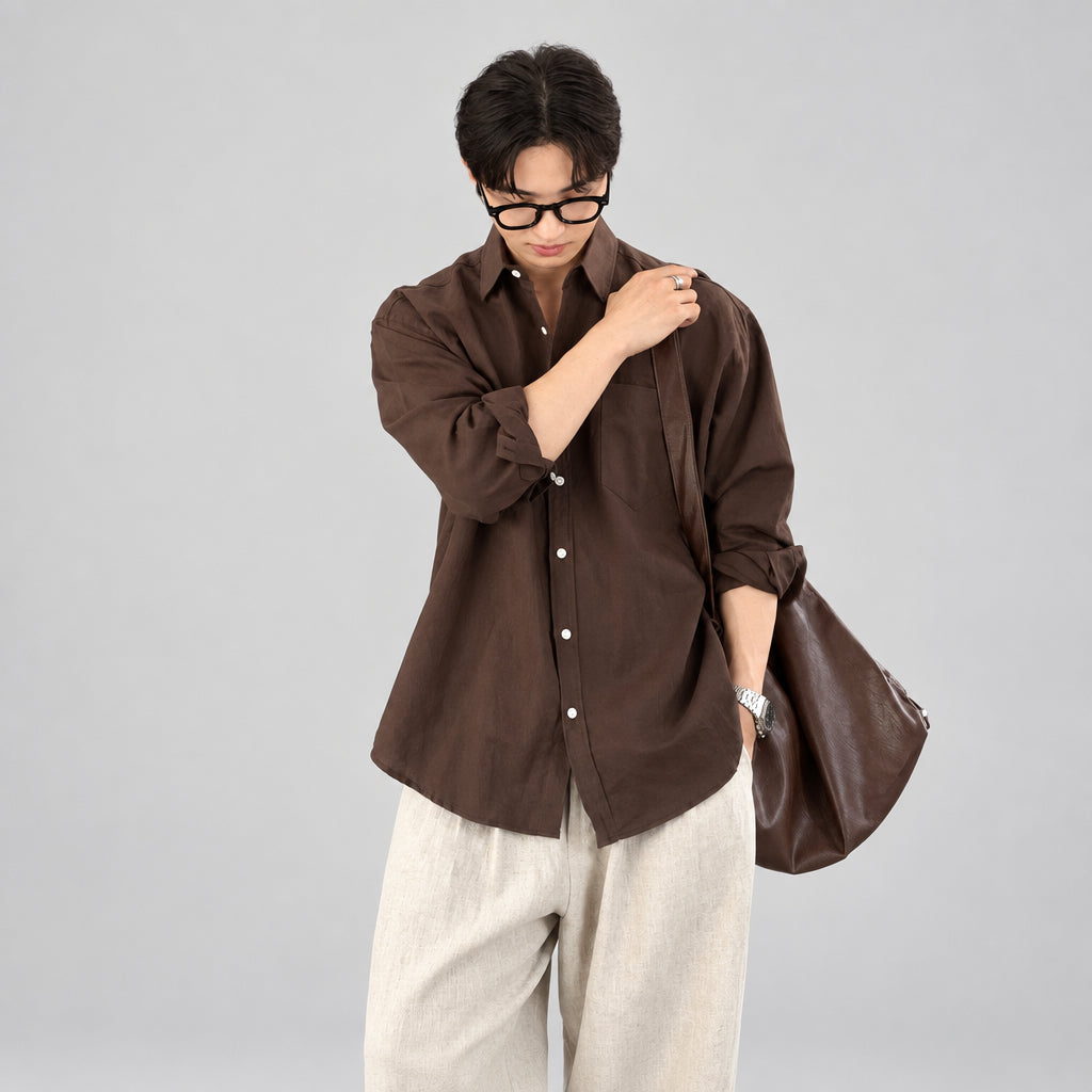 Person wearing a brown shirt